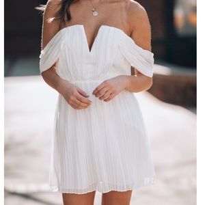 White pleated V-neck dress